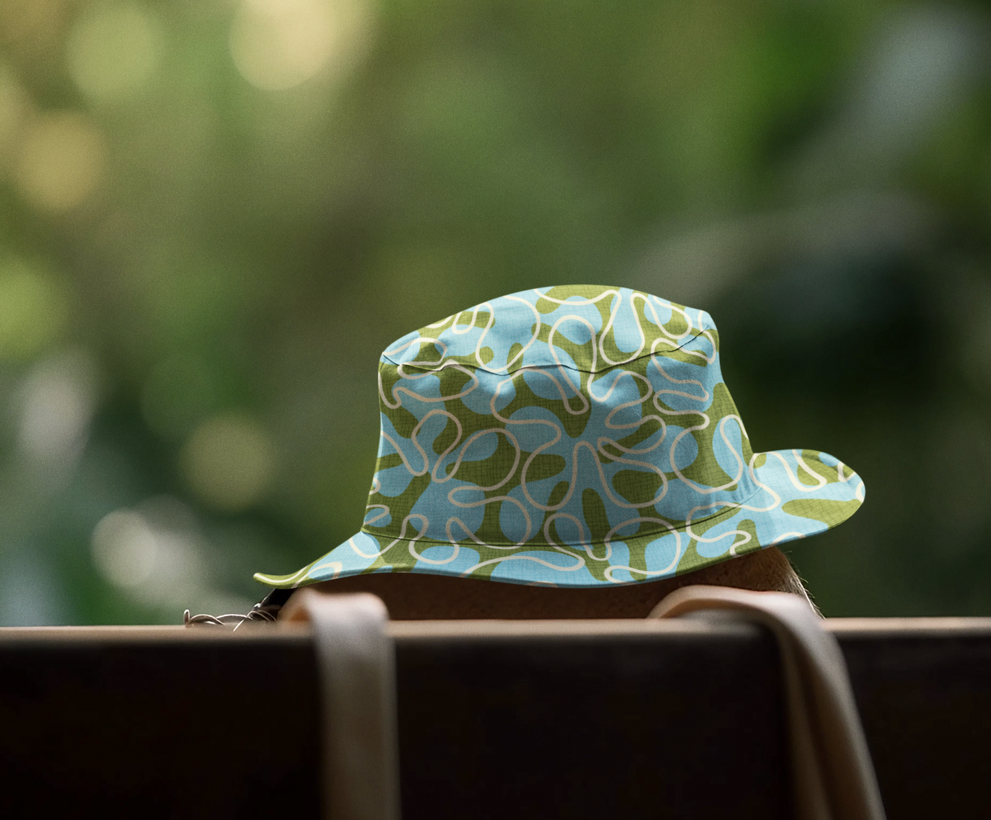 Summer Bucket Hat with Wild Abstract Surfer Print in Pool Blue and Green. Available in 2 sizes.